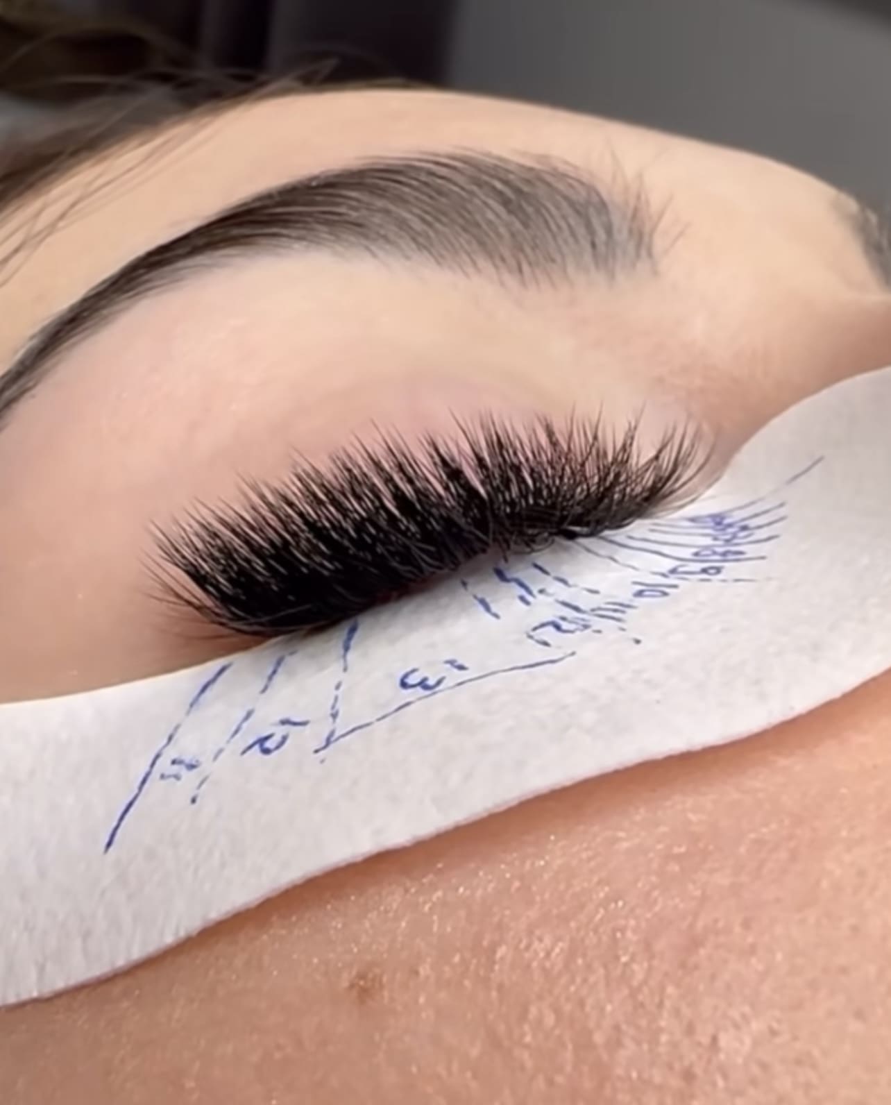 Use a pencil to recreate the lines you previously drew on the client's skin
