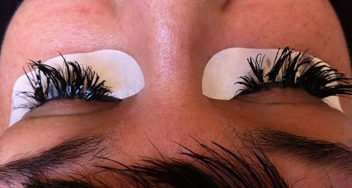 Lash extensions becoming tangled can result from improper activities